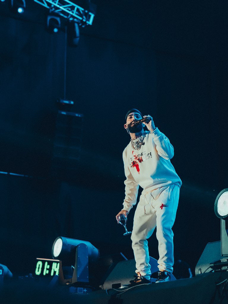 Uptown Savages logo cream suit