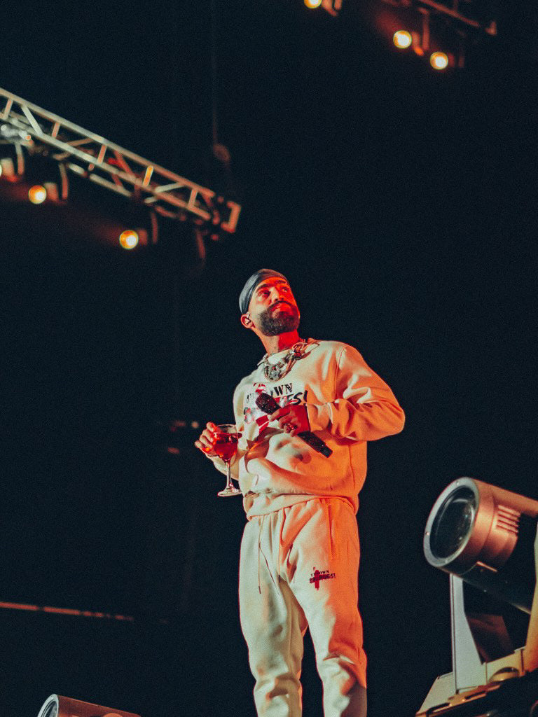 Uptown Savages logo cream suit