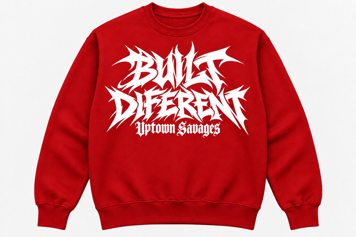 UPTOWN SAVAGES Built Diferent red crewneck sweatshirt with white graffiti lettering on the front