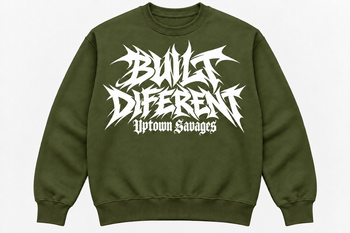 UPTOWN SAVAGES Built Diferent olive green crewneck sweatshirt with white graffiti lettering on the front