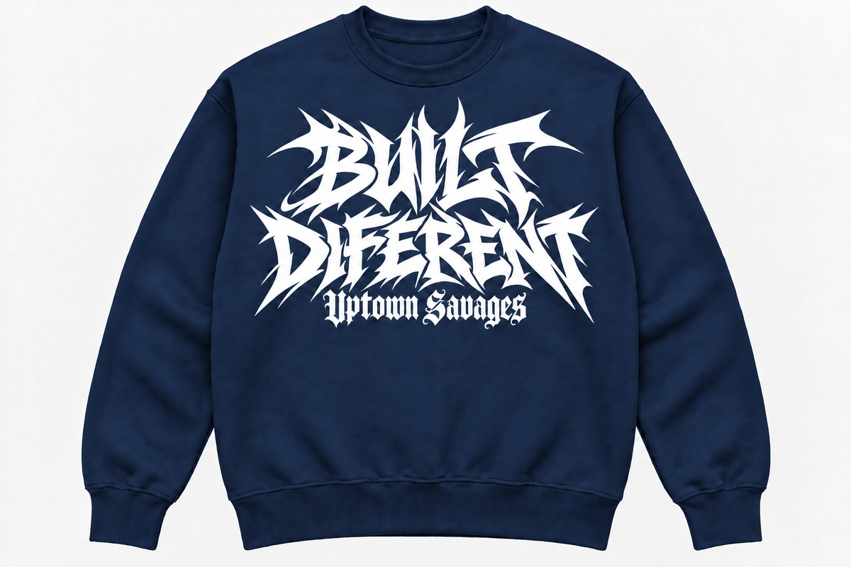UPTOWN SAVAGES Built Diferent navy crewneck sweatshirt with white graffiti lettering on the front