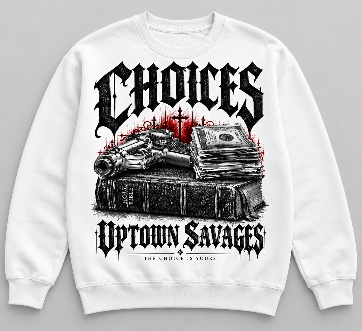 UPTOWN SAVAGES Choices white crewneck sweatshirt with Gothic lettering and red-accented Bible, cash and handgun graphic